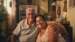 Senior cuban couple embraced sitting at home.