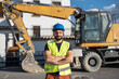 © Antonio Recena - construction worker near to backhoe looking at camera smiling