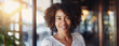 Headshot portrait of professional black woman entrepreneur in modern interior