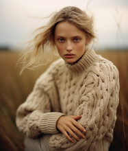 Beautiful Young Woman In Beige Knitwear Sweater.	