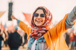 © VisualProduction - Portrait of a beautiful energetic muslim woman enjoying a music festival and having fun