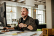 © Geber86 - Middle aged caucasian man using a computer at a office job