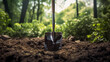 A Shovel in the Garden Dirt with a Blurry Background of Trees, Capturing the Serenity of Outdoor Work