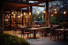 Luxury Restaurant With Tables And Chairs In The Evening. Restaurant Exterior