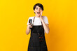 © luismolinero - Hairdresser woman isolated on yellow background with surprise and shocked facial expression