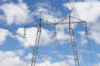 Overhead high voltage power line pylon in use with 400 kV AC.