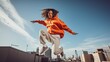 © Filip - Dynamic shot of a model in a streetwear outfit, captured mid-jump on a city rooftop, with skyline in the background
