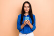 © deagreez - Portrait of stunning business lady hold use smart phone texting telegram instagram twitter isolated on beige color background