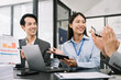© NINENII - Asian business people working as a good team in the office. Successful teamwork in a meeting, workplace concept.