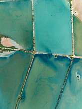 Aerial View Of Vibrant Turquoise Salt Ponds, Majorca, Spain

