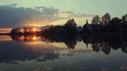 Wall Mural - Beautiful panoramic sunset reflecting on small lake in Germany.