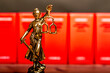 statue of Lady Justice, goddess Justitia, on the desk in a lawyer's office