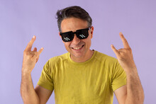 Man With "turn Down For What" Sunglasses In A Green T-shirt On A Light Blue Background