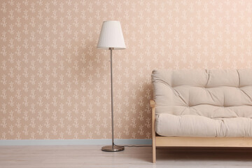 Wall Mural - Comfortable sofa and floor lamp near wall. Minimalist living room interior