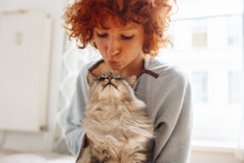 Portrait Red-haired Curly Young Woman With Beloved Fluffy Domestic Cat