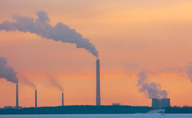 Wall Mural - Smoke from the chimneys of a steel plant in winter