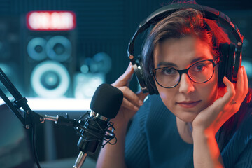 Wall Mural - Female radio host in the studio portrait