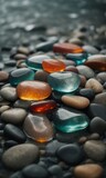Fototapeta Londyn - abstract beach colored stones on the beach, abstract beach stones background, colored stones
