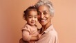 © iuricazac - A proud senior grandma shares a special moment with her adorable grandkid in a studio portrait. Generative AI