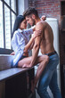 © georgerudy - Sexy young couple in kitchen