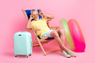 Sticker - Full body length cadre of retired man lying sunbed mallorca country sunny weather touch his glasses isolated on pink color background