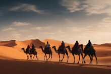 People Riding Camels On A Sand Dune In The Desert