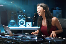 Young Female Artist Working In The Recording Studio