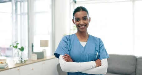 Wall Mural - Smile, crossed arms and face of woman nurse in living room of a modern retirement home. Happy, medical career and portrait of young Indian female healthcare worker with confidence in nursing facility