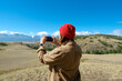 © lelechka - woman traveler taking a beautiful landscape at the mountains, Travel lifestyle concept