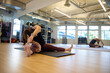 © Mat Hayward - Healthy woman stretching her legs in the gym during a workout.