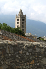 Wall Mural - The collegiate church of Santi Pietro e Orso is a Romanesque religious complex in Aosta; the bell tower and the ancient cloister are beautiful in Aosta Valley.