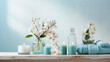 Spa salon light blue composition in wellness center. Spa still life background with aromatic candle, orchid flower and towel. Beauty spa treatment and relax. Relaxing background.