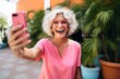 © VERTEX SPACE - happiness old retired pension female senior woman cheerful laugh fun taking selfie photo travel putdoor lifestle persure daylight
