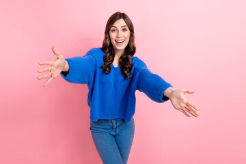 Sticker - Photo portrait of lovely young lady stretching hands want hugging dressed stylish blue garment isolated on pink color background