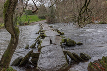 Ancient Man Made Clapper Bridge Across A Fast Flowing Ford