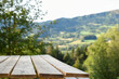 © tommoh29 - wooden picnic table for outdoor eating with a view of landscape from a garden