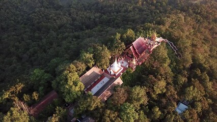 Wall Mural - Aerial view of Wat Phra That Doi Phra Chan temple in the morning. This place located on the serene top hill in Mae Tha district, Lampang province of Thailand.