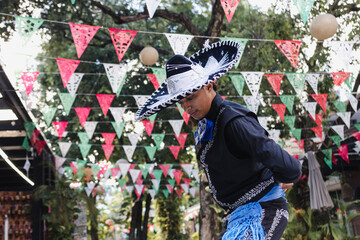 Wall Mural - Latin man wearing as Traditional Mexican mariachi at parade or cultural Festival in Mexico Latin America, hispanic people in independence day or cinco de mayo party