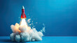 © Nakron - Toy rocket takes spewing smoke on a blue background the symbol for success is startup education and knowledge, Generative Ai