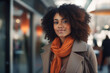 © JuanM - Young African American Woman with curly hair standing in front of a shop