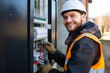 © AspctStyle - Happy male electrician fixing problems of automatic electric meter