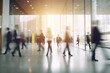 © Creative - Blurred image of business people walking in the lobby of a modern office building