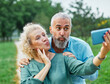 © Lumos sp - woman man outdoor mature couple selfie together camera photo phone smartphone mobile mid adult cell smiling love old lifestyle wife happiness middle aged nature active vitality