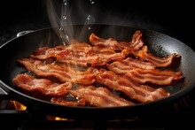 Frying Pan Filled With Slices Of Brown And Crispy Bacon Cooking On A Stove Top.