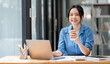 © NAMPIX - Shot of an attractive businesswoman sitting at her desk in an office.