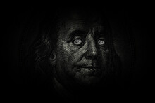 Ben Franklin's Face With Glowing Eyes On The Old US $100 Dollar Bill. Macro Grunge Style Photo. Large Resolution, Large Size, High Quality.