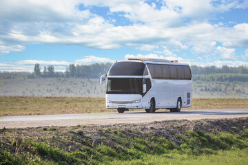 Poster - Tourist bus moves along a country road