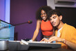© ADDICTIVE STOCK - Man and black woman recording music in studio