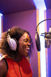 © ADDICTIVE STOCK - Black woman singing and creating song