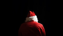 Silhouette Of Santa Claus From The Back View Isolated On A Black Background. Christmas Time.